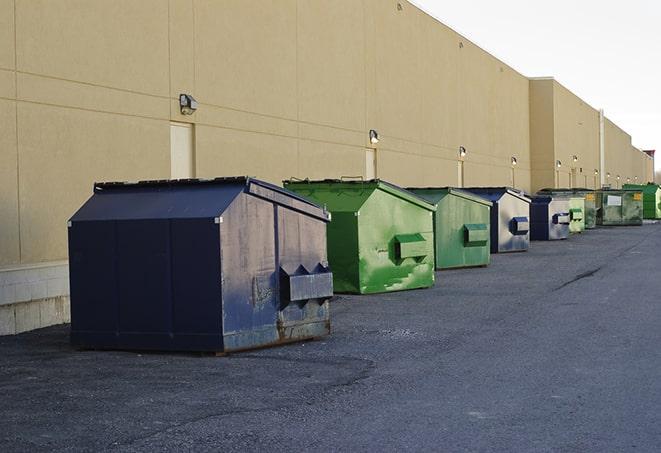 several large trash cans setup for proper construction site cleanup in Brunswick